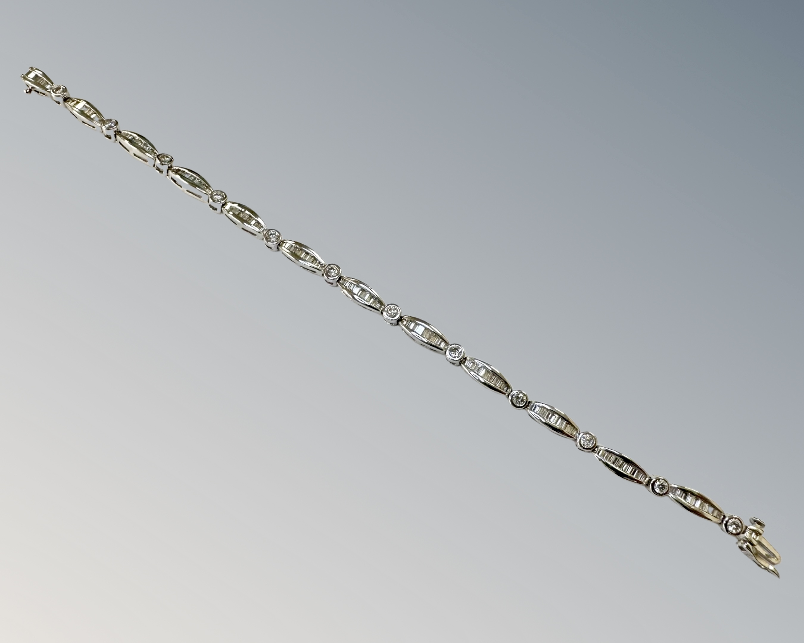 A 18ct white gold diamond bracelet set round and baguette stones, approximately 117 stones, - Image 2 of 2