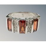A silver gem-set dress ring, size O/P.