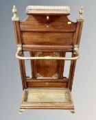 A late Victorian Aesthetic movement mahogany and brass hall stand by James Shoolbred & Co,