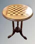 A 19th century circular mahogany chessboard topped occasional table on carved beech legs.