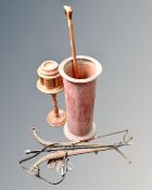 A metal stick pot in the form of a chimney pot containing a silver topped walking cane,