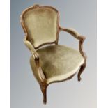 A continental carved beech salon armchair.