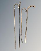 Three antique walking sticks including two silver-mounted examples,