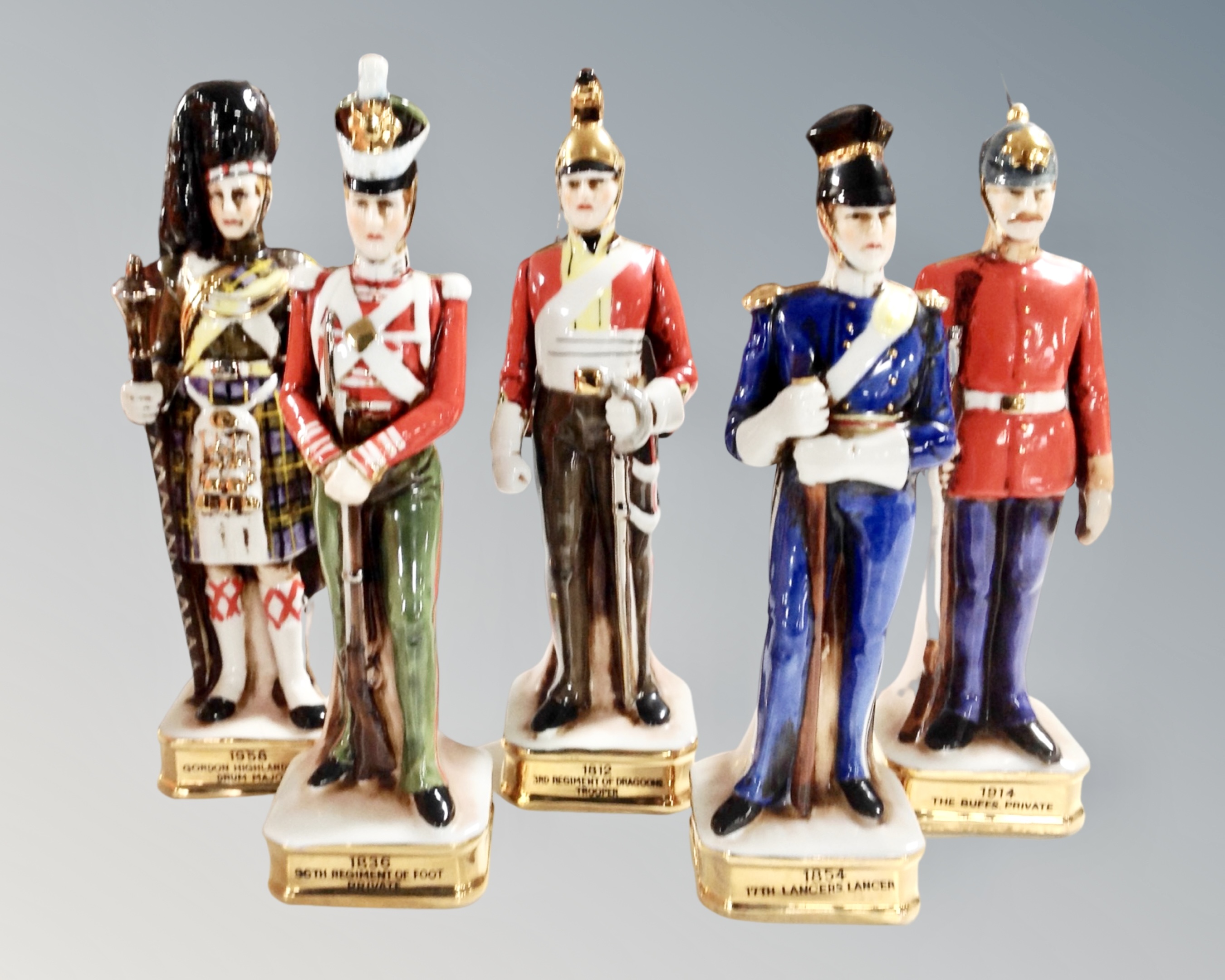 A set of five ceramic military figures.