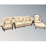 A contemporary four-piece lounge suite comprising of settee,