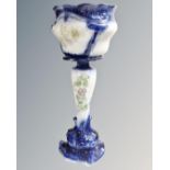 A glazed pottery jardiniere on stand.