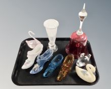 A cranberry glass wedding bell, together with eight further glass swans, shoes and vase,