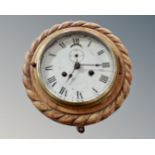 A 19th century nautical clock.