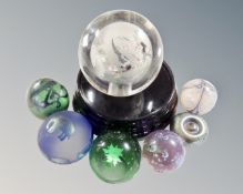 A large Chinese paperweight on stand, together with six further glass paperweights.