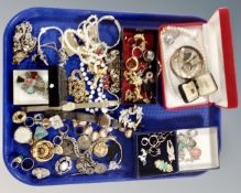 A tray containing costume jewellery, gilt cameo bracelet, dress rings, Scottish hardstone set,