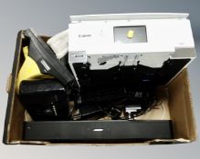 A box containing Canon multi-function printer, Karcher window vacuum, Bose sound bar with remote,
