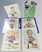 A set of Newcastle United Toon Army pin badges mounted on a cardboard stand together with a set of