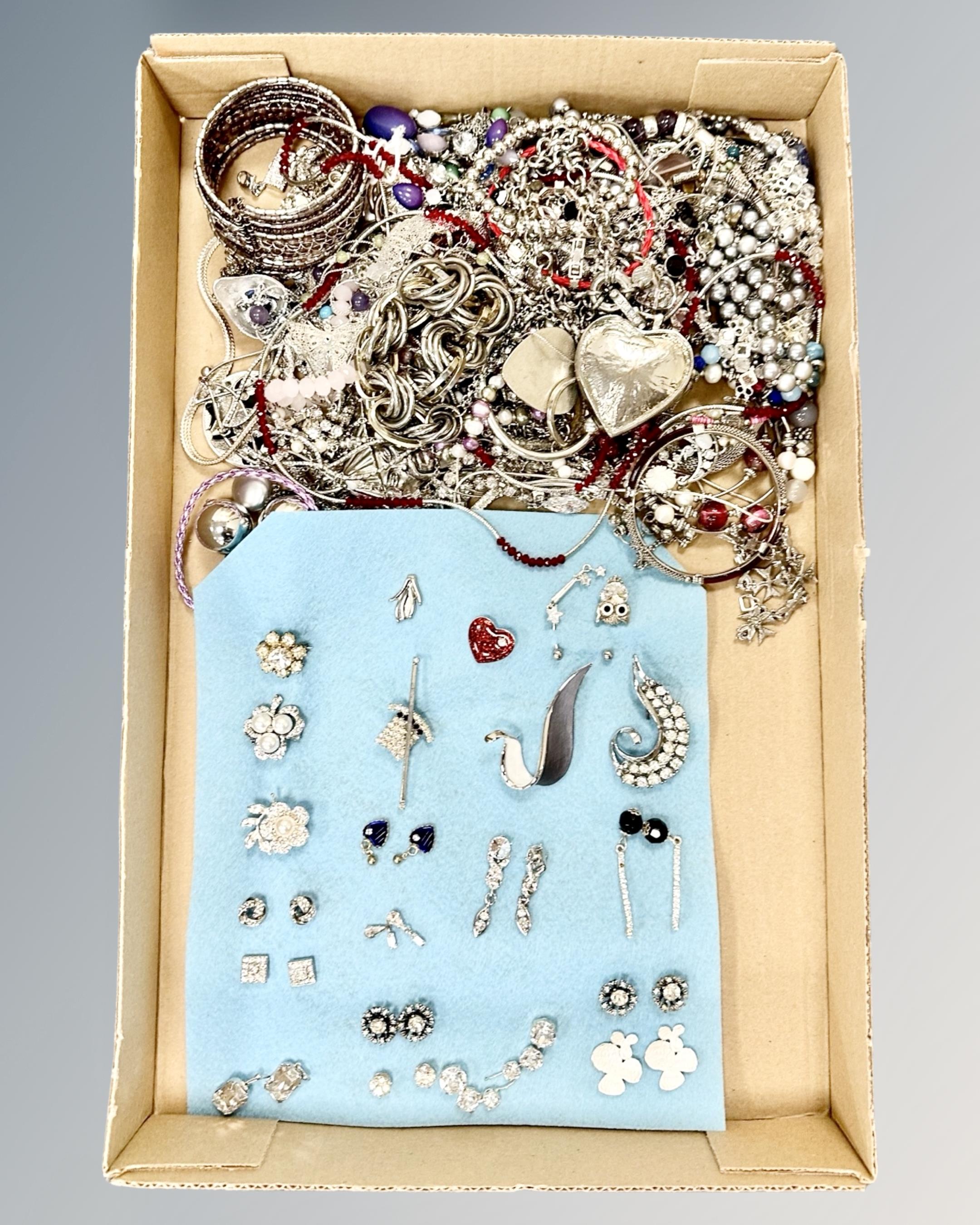 A collection of costume jewellery, white metal chains,