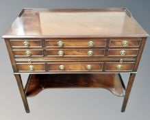 A Georgian style mahogany serving table with nine drawers