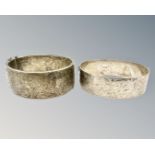 Two silver engraved antique cuff bangles, 74.8g.