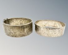 Two silver engraved antique cuff bangles, 74.8g.