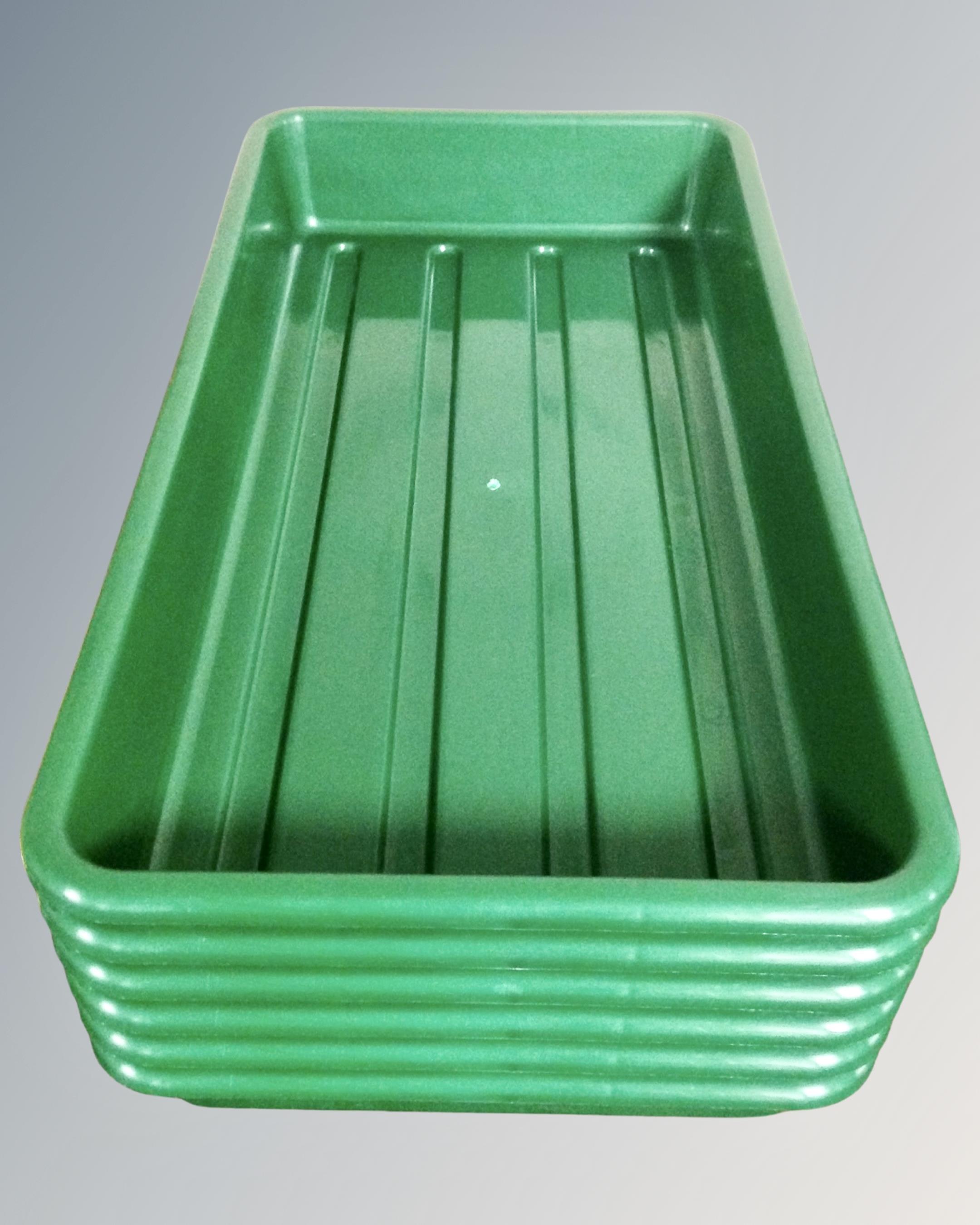 Six moulded plastic seeding trays