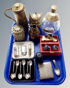 A tray of assorted brass ware, dimple whisky bottle, pocket lighters, cased plated tea spoons,
