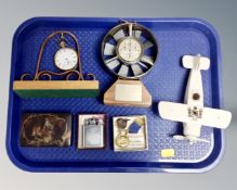 A tray of boxed Ronson lighter, badges, pocket watch on stand, velocity meter,