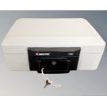 A Sentry 1160 fire resistant cash box with key