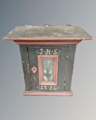 A 19th century Scandinavian oak painted wall cabinet bearing the date 1726