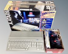 An Atari 520 ST computer, boxed together with a further box of mouse, two joy sticks,