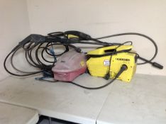 A Karcher 411A pressure washer with hose and gun together with a power devil pressure washer with