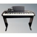 A Roland EP7 II E electric piano on stand,