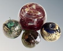 An Isle of White heart glass paperweight together with three further glass paperweights Azuri