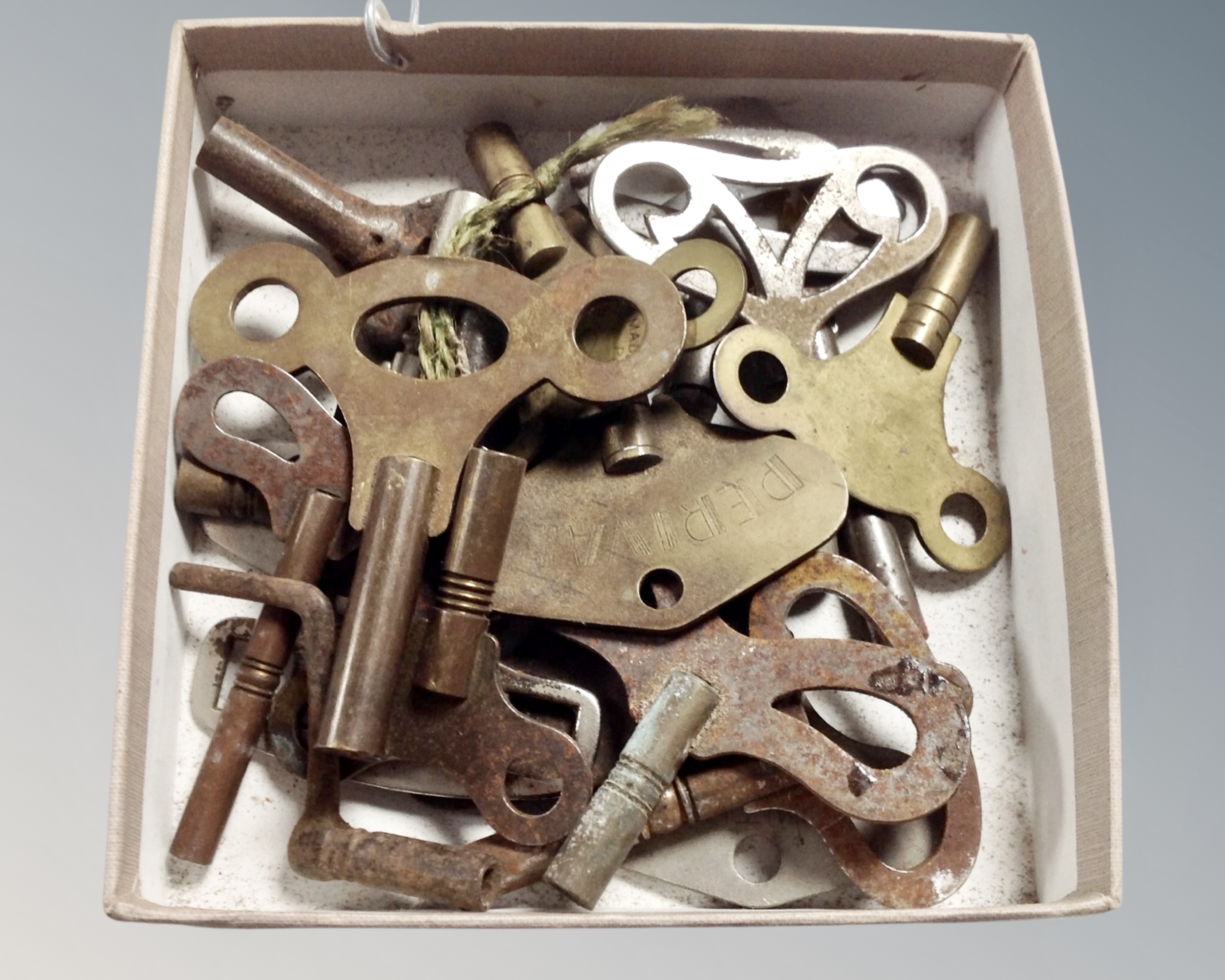 A box of antique and later clock keys