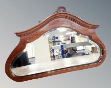 A 19th century shaped mahogany bevelled mirror together with a further hall mirror (2)