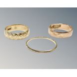 Three 9ct yellow gold band rings, 4.5g.