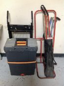 A plastic tool chest together with two folding sack barrows and bag containing drain rods,
