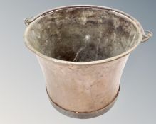 A 19th century copper cast iron swing handled bucket,