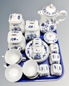 A continental blue and white floral patterned tea service with matching storage jars