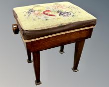 A late Victorian mahogany rise and fall piano stool, with tapestry seat,