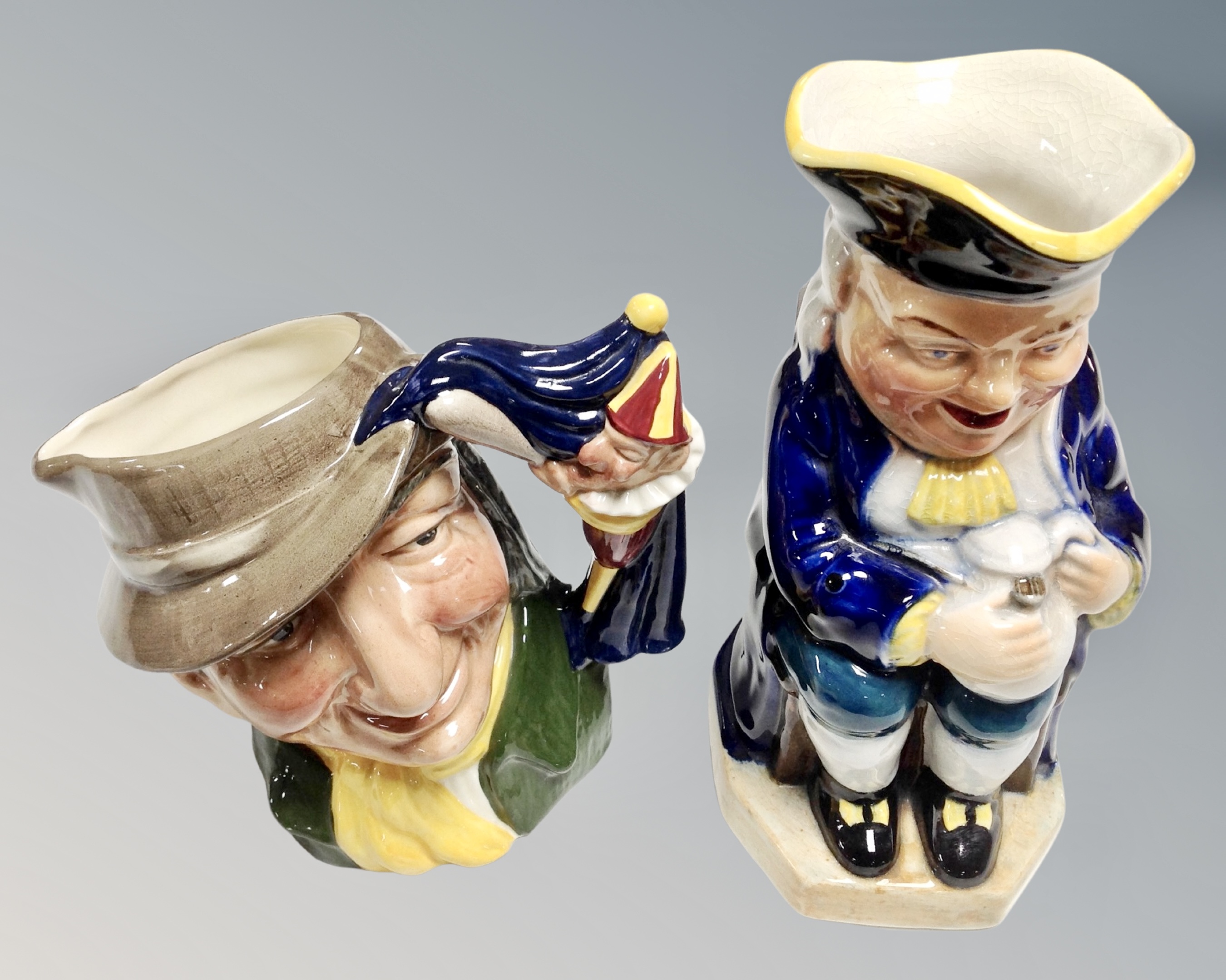 A Royal Doulton character jug - Punch and Judy together with a further Burlington ware character