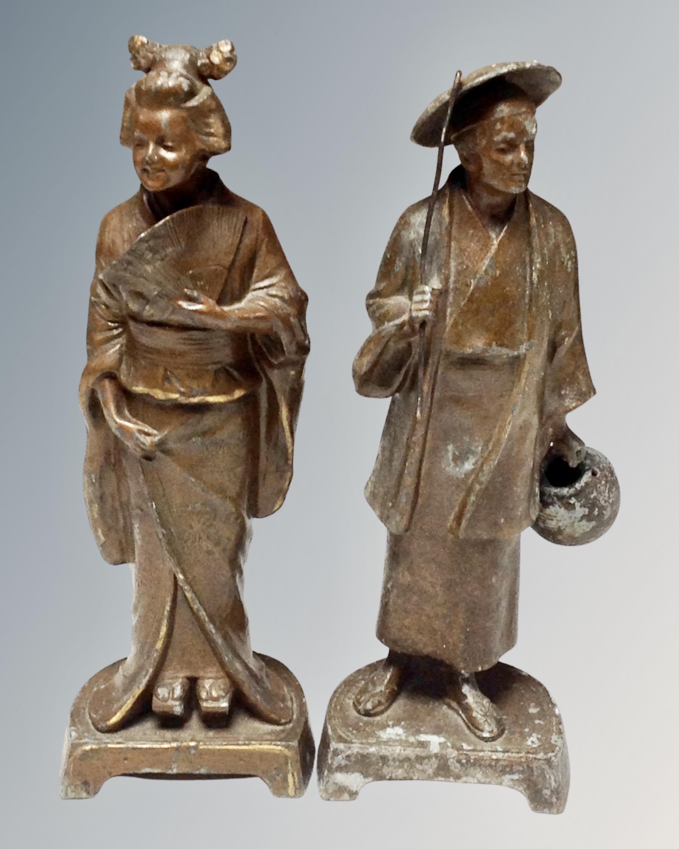 A pair of Chinese pot metal figures.