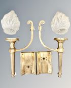 A pair of Art Deco brass wall lights,