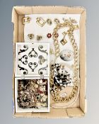 A box of costume jewellery, brooches and earrings,