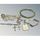 A jade bangle, together with Siam silver bracelet, silver religious fob, two silver crucifixes,