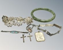 A jade bangle, together with Siam silver bracelet, silver religious fob, two silver crucifixes,
