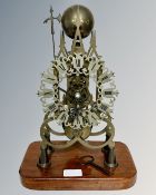 A Victorian style brass skeleton clock with single fusee movement, deadbeat escapement,