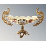 A decorative porcelain and gilt metal table centre piece with Bird of Paradise handles