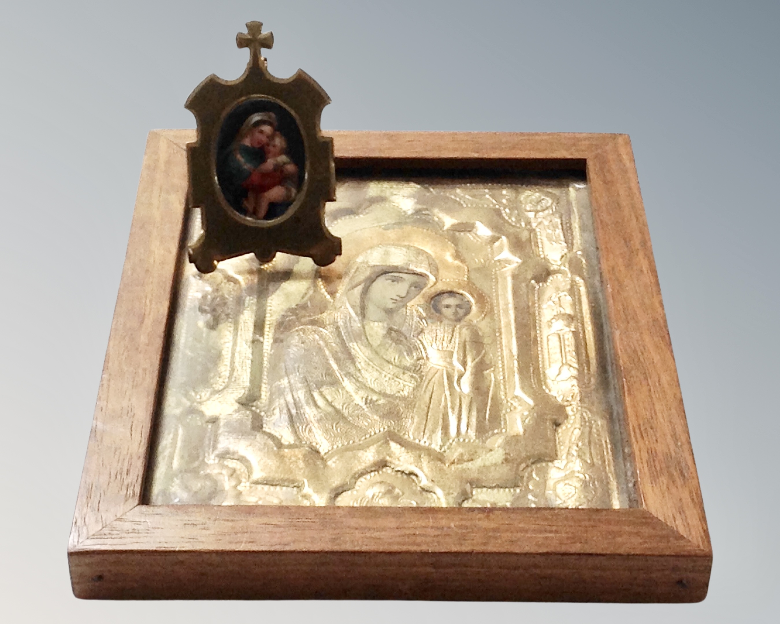 An antique miniature hand painted porcelain religious panel with brass frame together with further