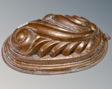 A Victorian copper jelly mould.