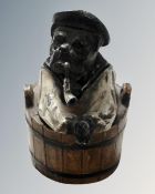 A 19th century cold painted metal inkwell in the form of a Sailor Bulldog sat in a basket
