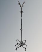 A contemporary metal hat and coat stand