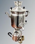 A 20th century twin handled stainless steel samovar with tap together with miniature stainless