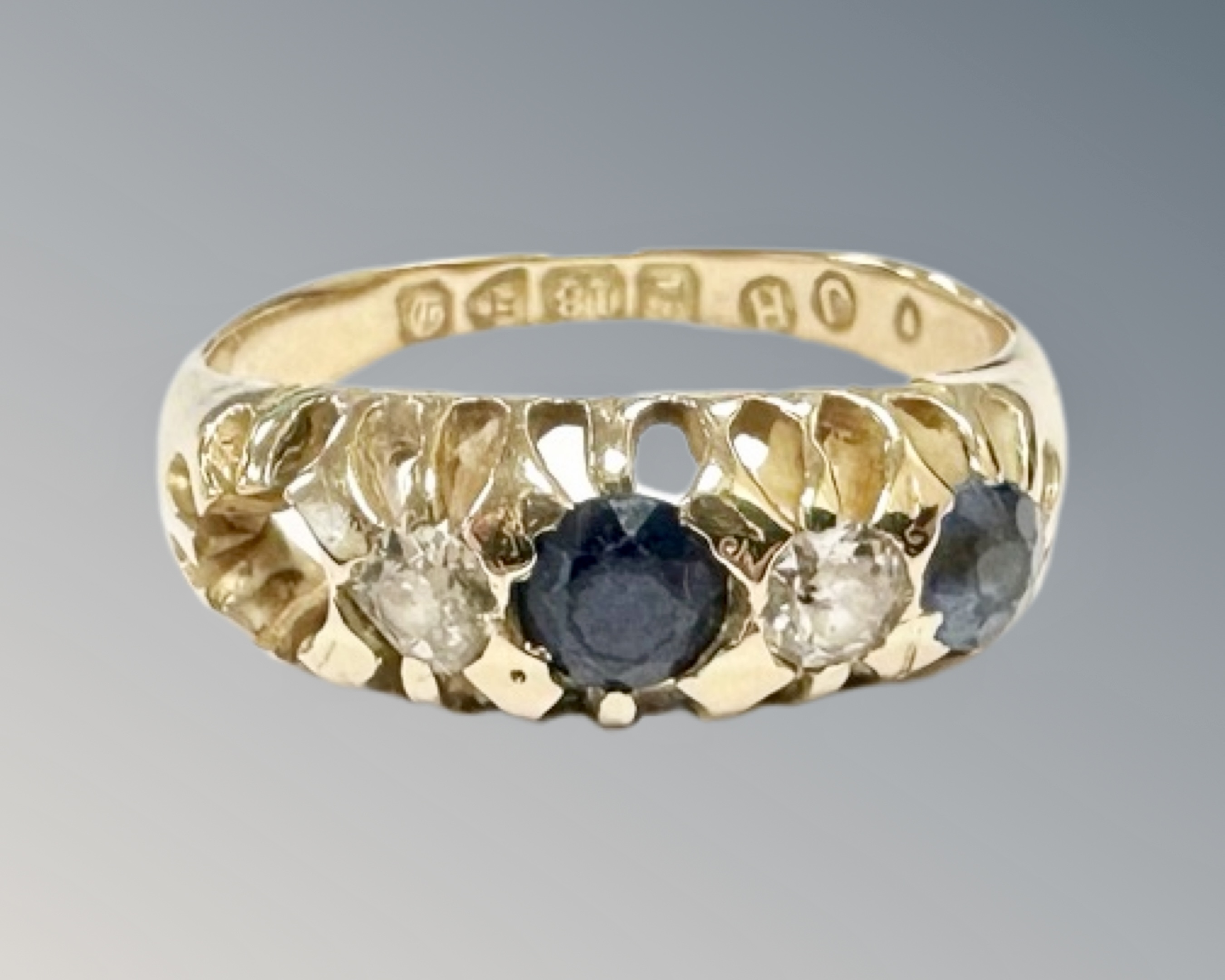 An 18ct yellow gold diamond set synthetic sapphire ring, size K (stone missing), 3.3g.